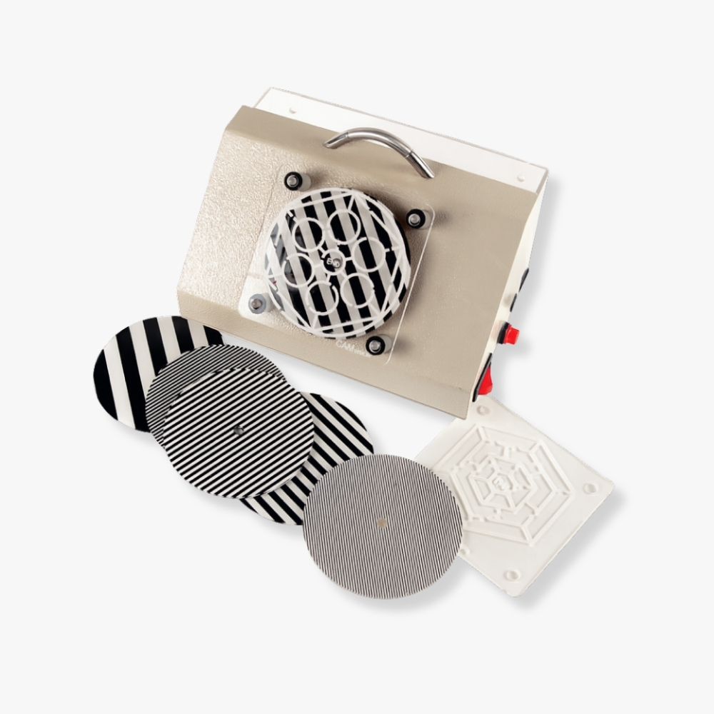 CAM Vision Stimulator – Beige device with handle and rotating patterned discs for lazy eye treatment